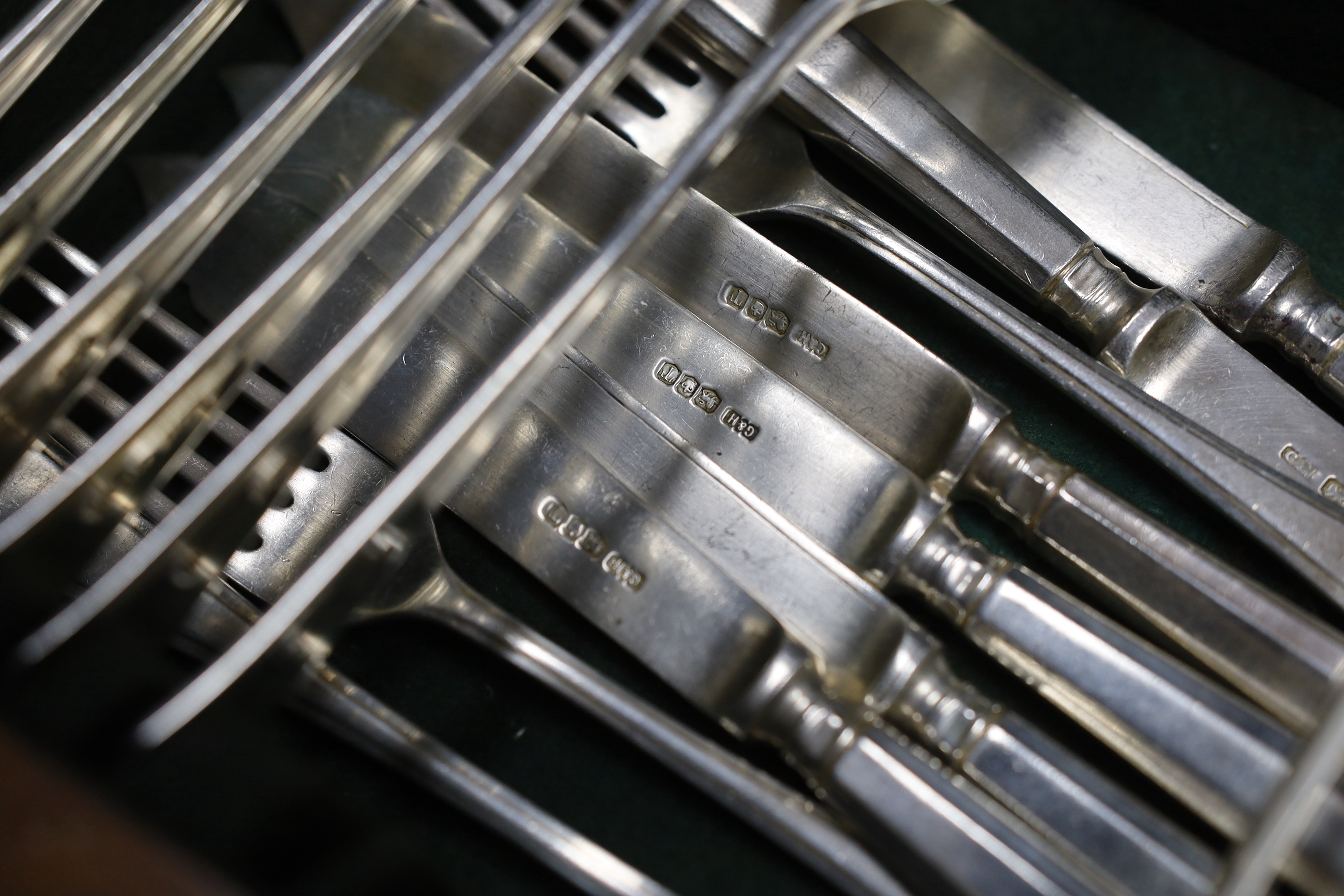 A part canteen of Elizabeth II silver cutlery for six by Gee & Holmes, comprising six each of the following, fish knives and forks, table and dessert forks, soup spoons, silver handled table and dessert knives, together